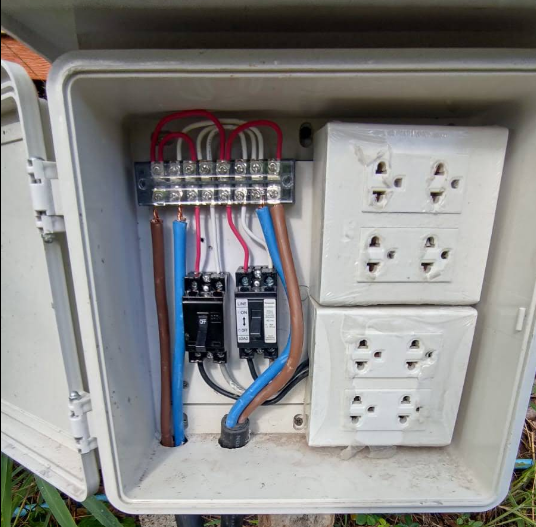Outdoor electrical distribution box with circuit breakers and power outlets installed by Koh Tao Engineering Group in Koh Tao, Thailand